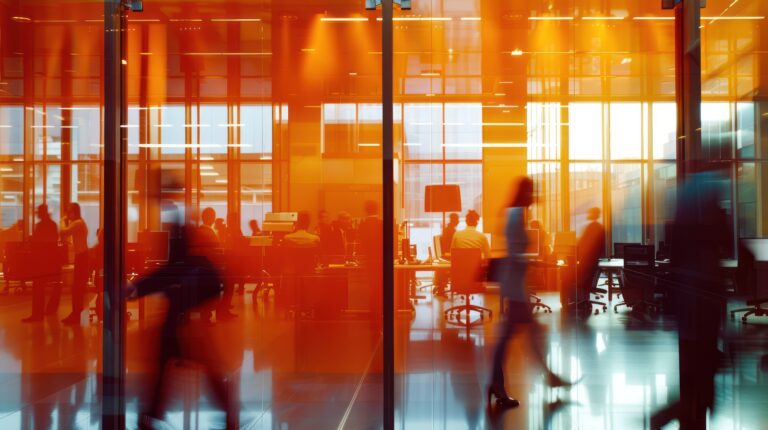 Silhouettes of People Walking in a Modern Office