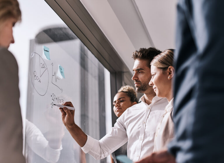 brainstorming business people writing glass planning coaching mission office collaboration ideas management team with notes window growth development solution